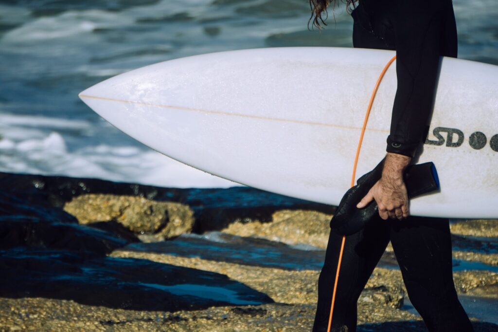 man with shortboard